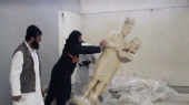 Isis fighters destroy ancient artefacts at Mosul museum 